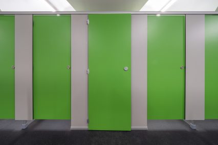 Thor toilet cubicles with bespoke door height for cleaning cupboard